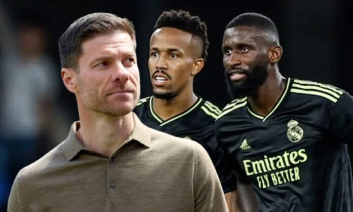 Xabi Alonso y una foto de Militao y Rüdiger jugando con el Real Madrid.