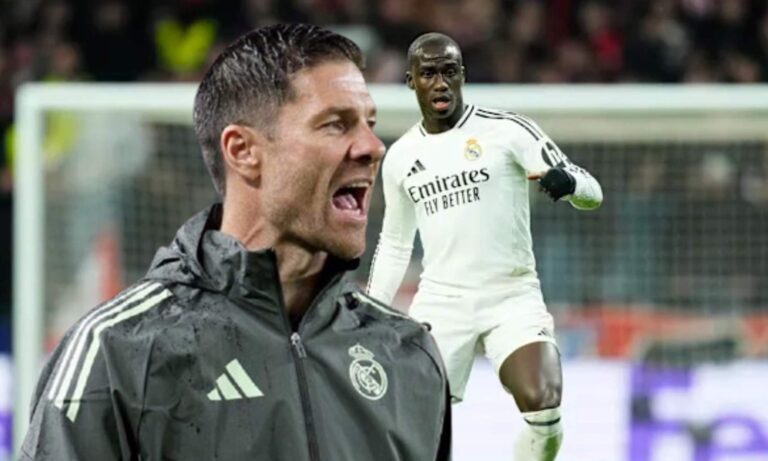 Xabi Alonso y Ferland Mendy jugando un partido con el Real Madrid.