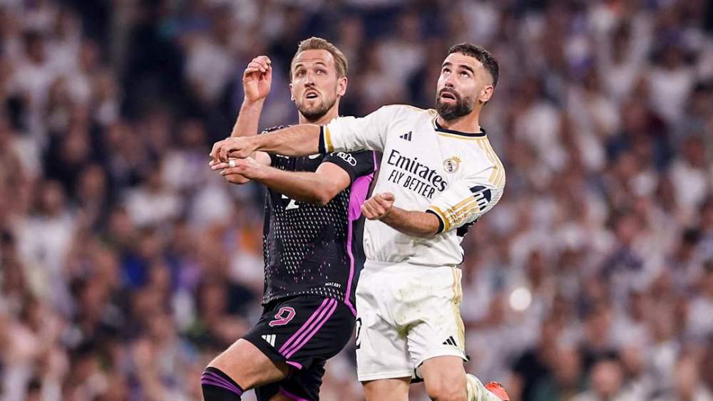 Dani Carvajal y Harry Kane disputando un balón durante el Real Madrid - Bayern Múnich de 2024.