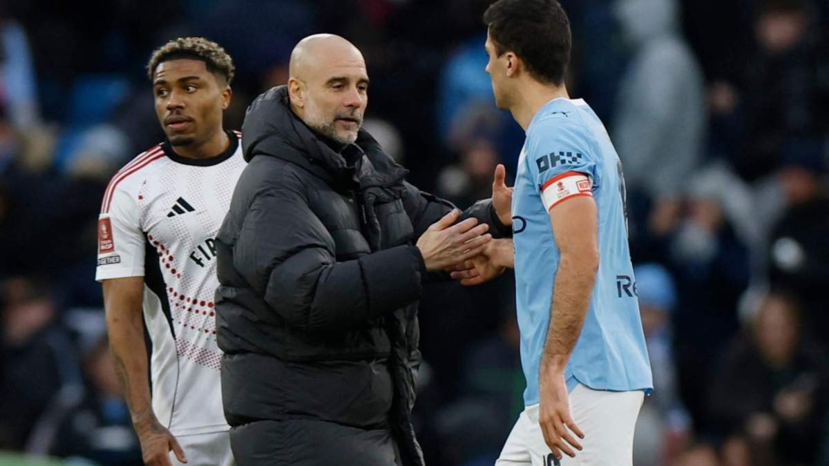Pep Guardiola y Rodri Hernández